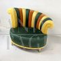 Pair of multicolored round design armchairs with asymmetrical backrest