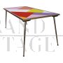 Design table in brass and color block glass