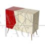 Design sideboard covered in red and parchment-colored glass