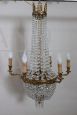 Antique chandelier from the late 19th century in gilded bronze with crystal drops