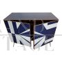 Sideboard with white and blue glass geometries