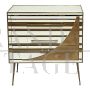 Three-drawer dresser with white and gold glass geometries