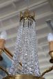 Antique chandelier from the late 19th century in gilded bronze with crystal drops