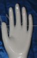 Glazed ceramic hand with crystal base