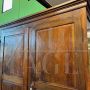 Large antique wardrobe from the early 19th century in walnut with diamond carved doors