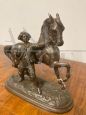 Antique antimony sculpture of a horse with a character, late 19th century