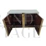 Two-door sideboard with light blue glass and brass geometries