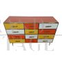 Dresser with 12 drawers in yellow and orange colored glass