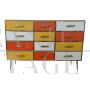 Dresser with 12 drawers in yellow and orange colored glass