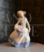 Vintage porcelain sculpture, little girl with a basket of flowers