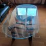 Design wooden coffee table with oval glass top