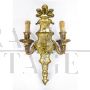 Pair of baroque style wall lights in golden brass