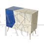 Design sideboard covered in light blue and parchment-colored glass tiles