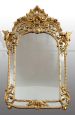 Antique Napoleon III mirror in gilded wood carved with griffins and rocailles