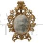 Antique baroque oval cartouche mirror in carved and gilded wood, 18th century