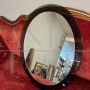 Vintage 1970s oval mirror with green glass frame