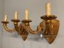 Pair of antique gilded candle-shaped wall lights from 19th century                         
                            