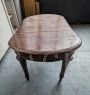 Antique extendable table with oval top