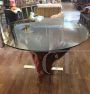 Vintage table with round crystal top on cherry tree trunk and branches