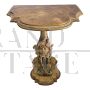 Pair of small antique style consoles carved with cherubs      