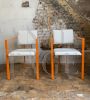 Pair of orange postmodern armchairs with white bouclé wool fabric