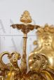 Pair of chiseled gilt bronze wall lights in antique style