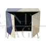 Design sideboard covered in light blue and parchment-colored glass tiles