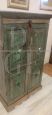 Antique Tibetan cabinet in green lacquered teak wood