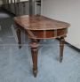 Antique extendable table with oval top