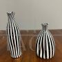 Pair of black and white striped Murano glass vases with flattened shape, 1930s - 1940s