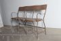 Vintage industrial metal bench with folding seats