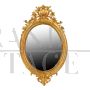 ANTIQUE OVAL MIRROR WITH GOLDEN FRAME, 19th CENTURY.