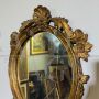 Small French oval mirror from the late 19th century in gilded wood