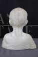 Marble bust sculpture of a child from the early 1900s