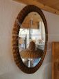 Vintage oval mirror with wicker frame