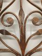 Antique wrought iron bed headboard painted with gold highlights, 19th century