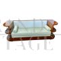 Art deco sofa in wood and white eco-leather with open shelves                