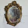 Small French oval mirror from the late 19th century in gilded wood