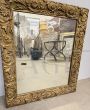 Antique gilded mirror with floral carvings, 19th century