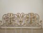 Antique wrought iron bed headboard painted with gold highlights, 19th century