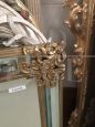 Mirror in gilded wood with flowers, antique style