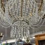 Early 1900s 8-light chandelier in gold metal with crystal drops