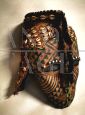 Antique African tribal mask with beads and leopard skin