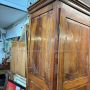 Large antique wardrobe from the early 19th century in walnut with diamond carved doors