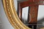 Pair of antique carved and gilded oval frames