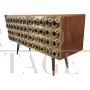 Three-door brass sideboard with circular red glass inserts