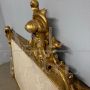 Antique 19th century bed headboard in carved wood with gold leaf