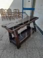 Antique carpenter's bench table from the early 19th century in oak with vice