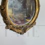 Small French oval mirror from the late 19th century in gilded wood