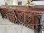 Living room set with buffet & hutch cupboard and a sideboard, all carved with statues